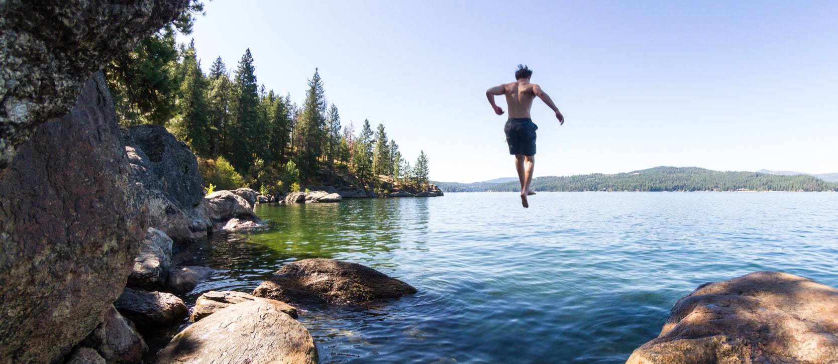 Person jumping in the lake near Fort Grounds, Coeur d'Alene