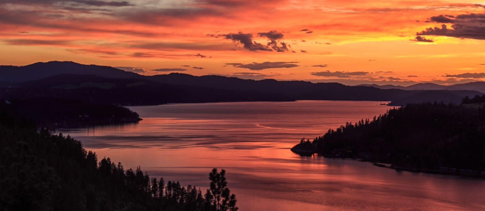 Stunning sunset overlooking a beautiful lake in Coeur d'Alene near The Falls At Hayden Lake 